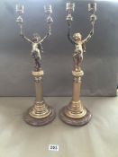 A PAIR OF GILDED COLUMN CANDELABRAS WITH MARBLE BASES