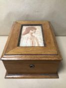 A VINTAGE WOODEN BIBLE BOX WITH A PICTURE OF A YOUNG LADY ON TOP