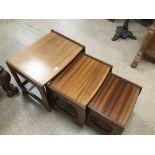 A TEAK MID CENTURY NEST OF THREE TABLES