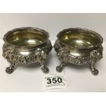 A PAIR OF LARGE WILLIAM IV SILVER SALTS, EACH RAISED UPON FOUR LION CLAW AND BALL FEET, RIBBED