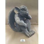 A FIBREGLASS AND RESIN GARGOYLE SEATED (LOOKING FED UP) 31CM