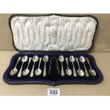 AN EARLY 20TH CENTURY UNUSUAL SET OF TWELVE SILVER BRIGHT CUT TEASPOONS WITH MATCHING SUGAR TONGS,