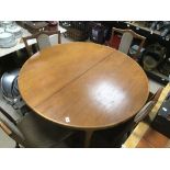 AN EXTENDING NATHAN MID CENTURY TEAK TABLE WITH FOUR DINING CHAIRS