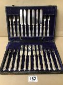 A CASED SET OF CUTLERY WITH SILVER HANDLES