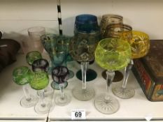 A COLLECTION OF COLOURED DRINKING GLASSES, INCLUDING HOCK WINE GLASSES, APERITIF AND MORE