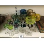 A COLLECTION OF COLOURED DRINKING GLASSES, INCLUDING HOCK WINE GLASSES, APERITIF AND MORE