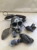 AN AFRICAN VOODOO ITEM WITH A MONKEYS SKULL
