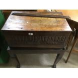 AN EARLY OAK WOODEN CHEST ADAPTED TO FIT ON A OAK STAND