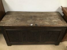 A CIRCA 18TH CENTURY COFFER WITH CARVING TO THE FRONT