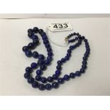 A LAPIS LAZULI NECKLACE OF GRADUATED FORM WITH 9CT GOLD CLASP
