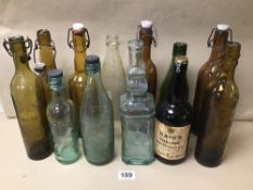 A COLLECTION OF VINTAGE GLASS ALCOHOL BOTTLES INCLUDING HAIG