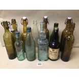 A COLLECTION OF VINTAGE GLASS ALCOHOL BOTTLES INCLUDING HAIG