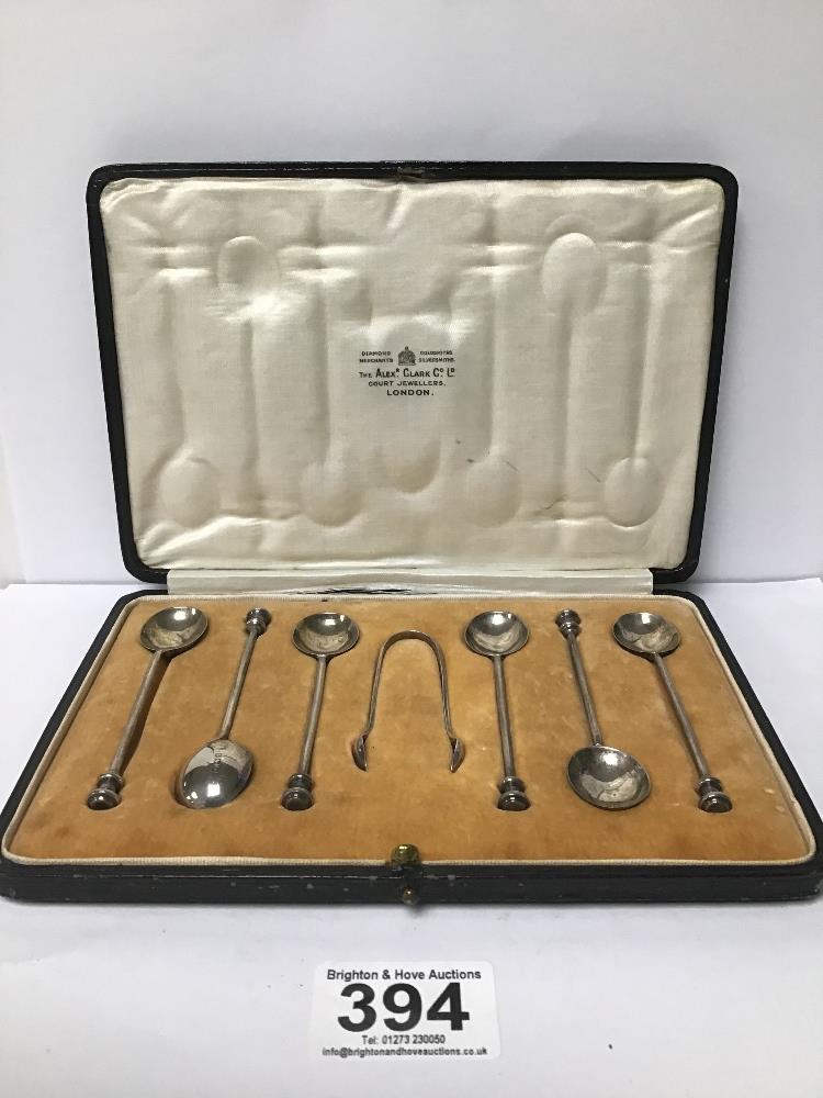 A SET OF SIX GEORGE V SILVER COFFEE SPOONS WITH SEAL LIKE ENDS, TOGETHER WITH MATCHING SUGAR