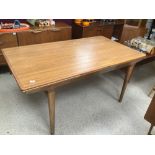 A DANISH MID CENTURY EXTENDING DINING TABLE