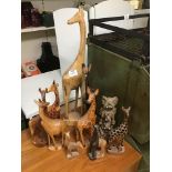 A COLLECTION OF WOODEN GIRAFFES AND ELEPHANTS LARGEST 60 CM