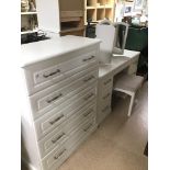 A PART MODERN BEDROOM SUITE COMPRISING OF A DRESSING TABLE WITH MIRROR AND STOOL AND A FIVE DRAWER