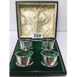 A SET OF FOUR SILVER NAPKIN RINGS IN ORIGINAL FITTED CASE BY WALKER & HALL, HALLMARKED SHEFFIELD