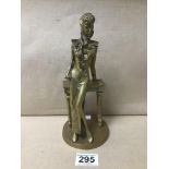 A BRONZE FIGURE OF A LADY RESTING ON A SIDE TABLE, 23.5CM HIGH