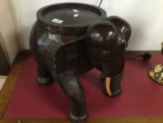 A LARGE CARVED WOODEN ELEPHANT WITH STORAGE 38 CM HIGH