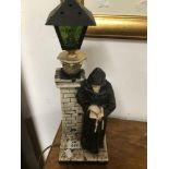 A SIDE LAMP OF A ROBBED MAN READING