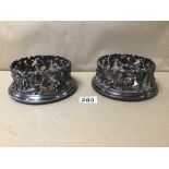 A PAIR OF LATE 19TH/EARLY 20TH CENTURY SILVER PLATE WINE BOTTLE COASTERS BY ELKINGTON & CO, WITH
