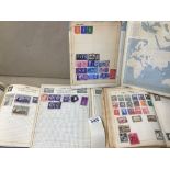 FOUR ALBUMS OF VINTAGE STAMPS.