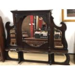 A MAHOGANY OVERMANTLE MIRROR WITH BEVELLED GLASS.