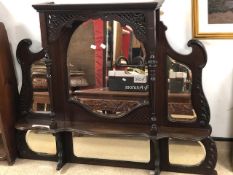 A MAHOGANY OVERMANTLE MIRROR WITH BEVELLED GLASS.