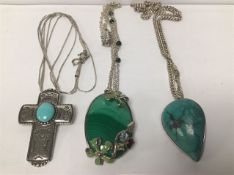 THREE MODERN SILVER PENDANTS ON CHAINS, INCLUDING ONE WITH COLOURED ENAMEL FLOWERS AND SET WITH