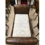 A LOW REGENCY LEATHER WINDOW SEAT/CHAISE LOUNGE A/F