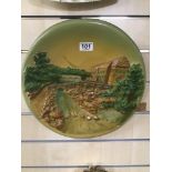 A PLASTER WALL PLAQUE, SIGNED TO REVERSE FL COPYRIGHT NO 1000, 37CM DIAMETER