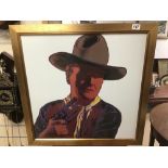 A REPRODUCTION SIGNED ANDY WARHOL PRINT OF JOHN WAYNE FRAMED AND GLAZED 75 X 75CMS