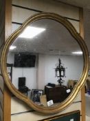 A VINTAGE ORIENTAL STYLE MIRROR IN A GILDED FRAME 61 X 61 CM