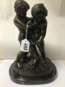 A BRONZE SCULPTURE OF TWO BOYS WRESTLING SIGNED GERIAFVICHI ON AN OVAL MARBLE BASE
