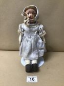 A VINTAGE DOLL ON STAND NUMBERED TO NECK 68-5