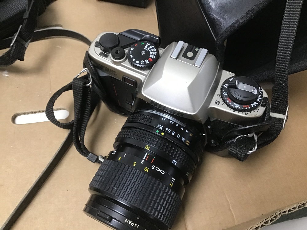 THREE NIKON CAMERAS WITH ONE OTHER, INCLUDES A NIKON F2, FE10, AND A M90 - Image 4 of 7