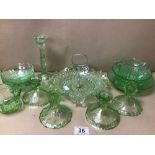A COLLECTION OF GREEN GLASSWARE INCLUDING CANDLESTICKS, CAKE STAND ETC