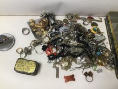 A TIN OF COSTUME JEWELLERY AND MORE