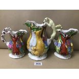 A SET OF THREE LATE 19TH/EARLY 20TH CENTURY HUNTING JUGS, EACH WITH HOUND HANDLES