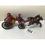 AN EARLY CAST IRON TOY OF A 19TH CENTURY HORSE DRAWN FIRE ENGINE