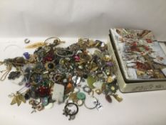 A TIN OF MIXED COSTUME JEWELLERY