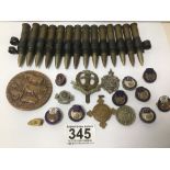 A QUANTITY OF BADGES AND BULLETS (DATED 1940) MILITARY