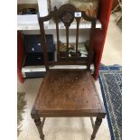 A VINTAGE WOODEN HALL CHAIR