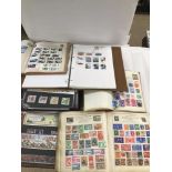 A QUANTITY OF STAMP ALBUMS AND FIRST DAY COVERS