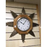 A VINTAGE BATTERY OPERATED STARBURST CLOCK
