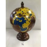 A VINTAGE WALNUT TERRESTRIAL GLOBE 27 CM HIGH