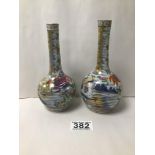TWO SIMILAR EARLY CHINESE PORCELAIN FAMILLE ROSE BOTTLE VASES, HIGHLY DECORATED THROUGHOUT, 16.5CM