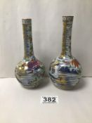 TWO SIMILAR EARLY CHINESE PORCELAIN FAMILLE ROSE BOTTLE VASES, HIGHLY DECORATED THROUGHOUT, 16.5CM