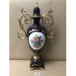 A LARGE CONTINENTAL PORCELAIN TWIN HANDLED VASE WITH GILT MEDAL HANDLES AND FINIAL TO LID, 49CM