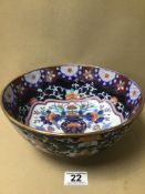 AN ORIENTAL CERAMIC BOWL OF CIRCULAR FORM, DECORATED THROUGHOUT WITH POLY-CHROME ENAMELS,